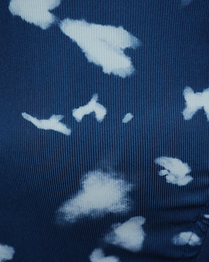 Close-up of a dark fabric with light blue floral patterns