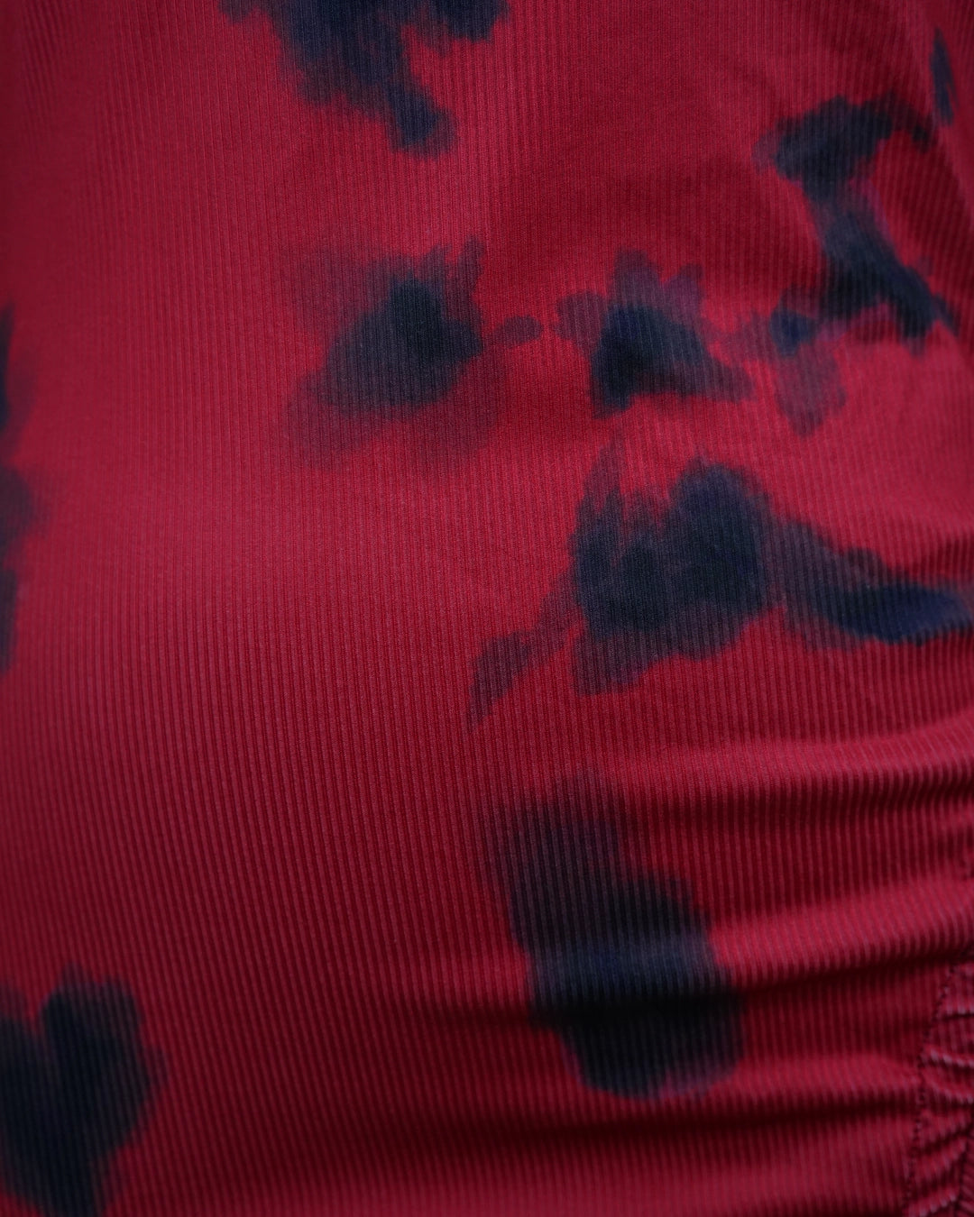 Red fabric with black floral patterns