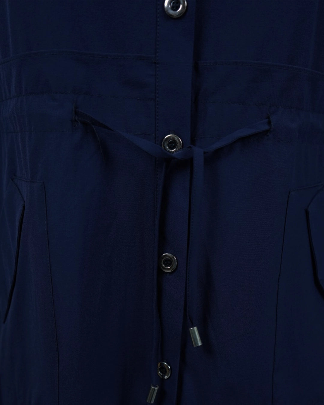 Close-up of a navy blue jacket with buttons and drawstrings.