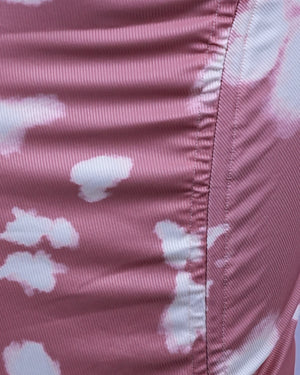Close-up of pink fabric with white cloud pattern