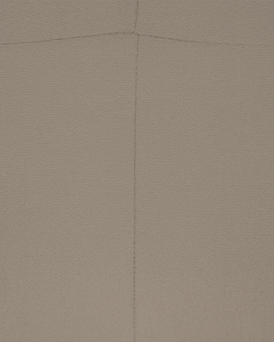 Brown textured fabric with a diagonal seam