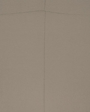 Brown textured fabric with a diagonal seam
