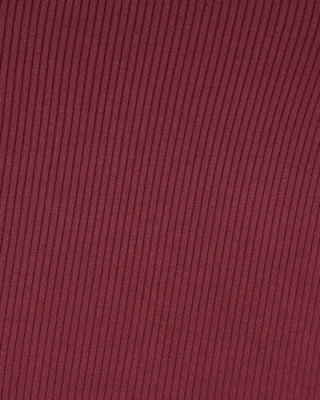 Close-up of ribbed maroon fabric texture