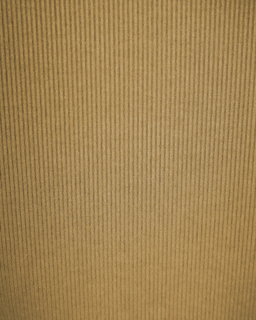 Close-up of a textured brown fabric surface