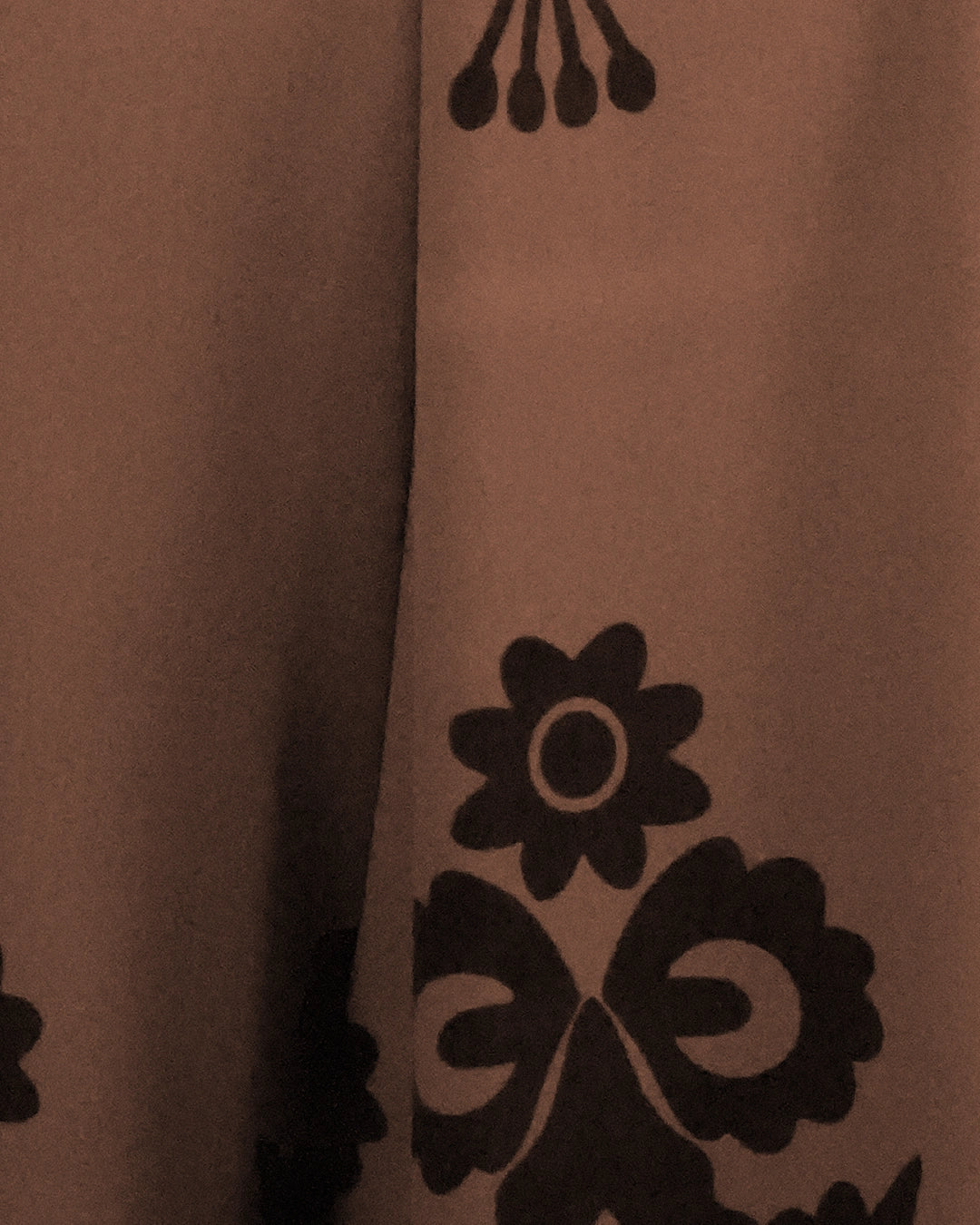 Brown fabric with black floral patterns