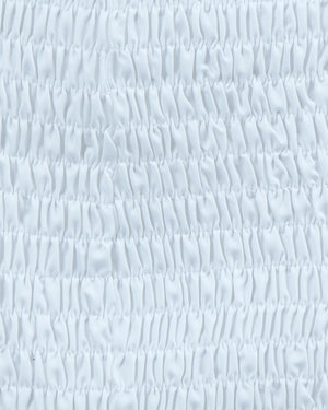 Textured light blue background with wavy pattern