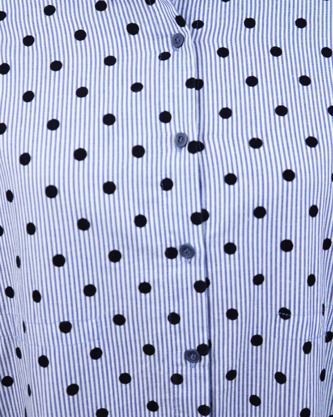 Close-up of a blue shirt with black polka dot pattern