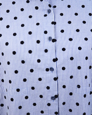 Close-up of a blue shirt with black polka dot pattern