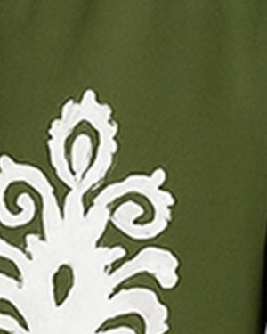 White decorative pattern on a green background