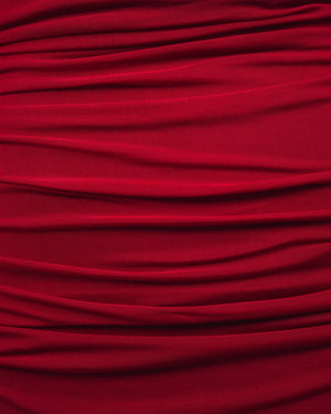 Close-up of red fabric with pleated texture