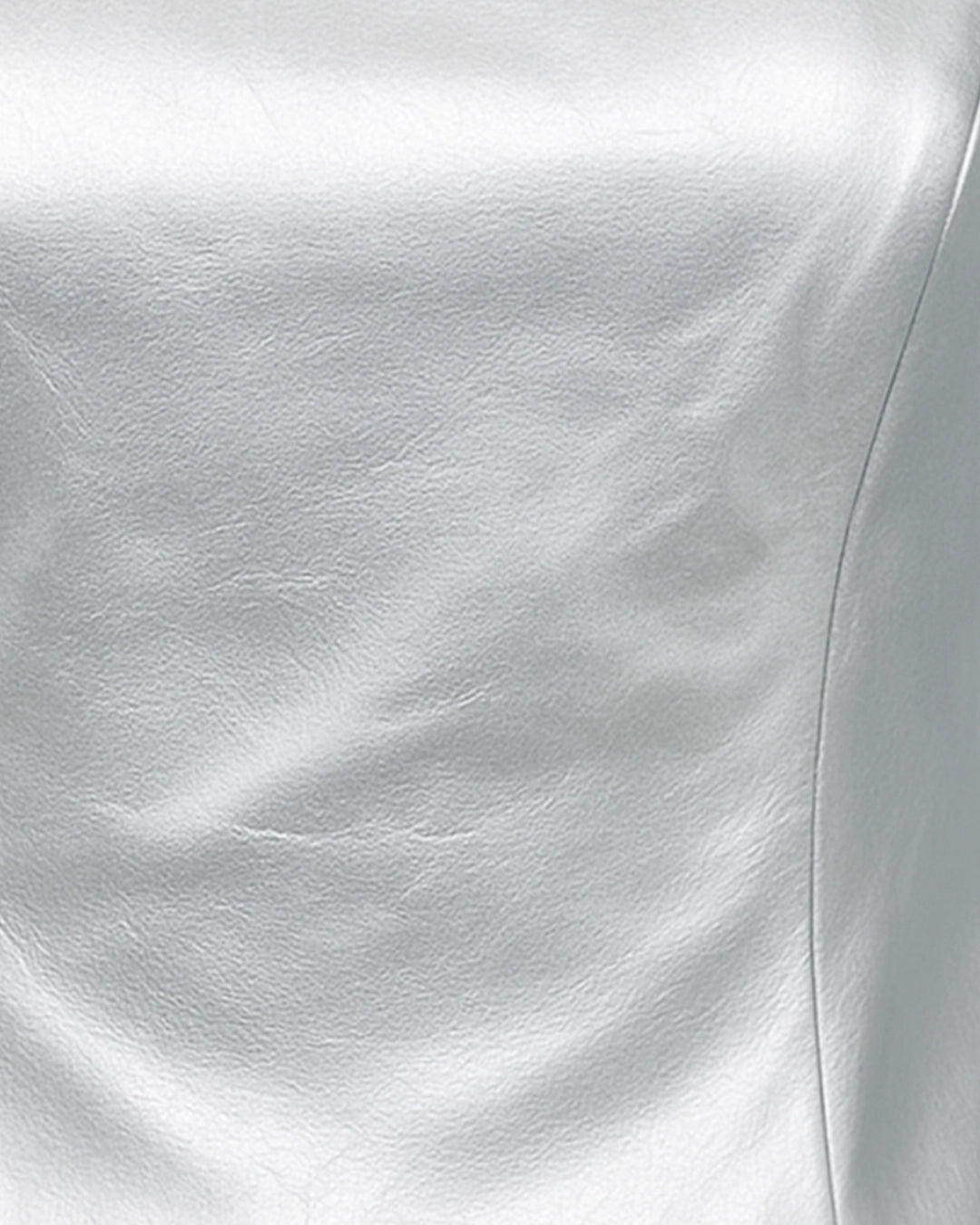 Close-up of white satin fabric with a subtle texture