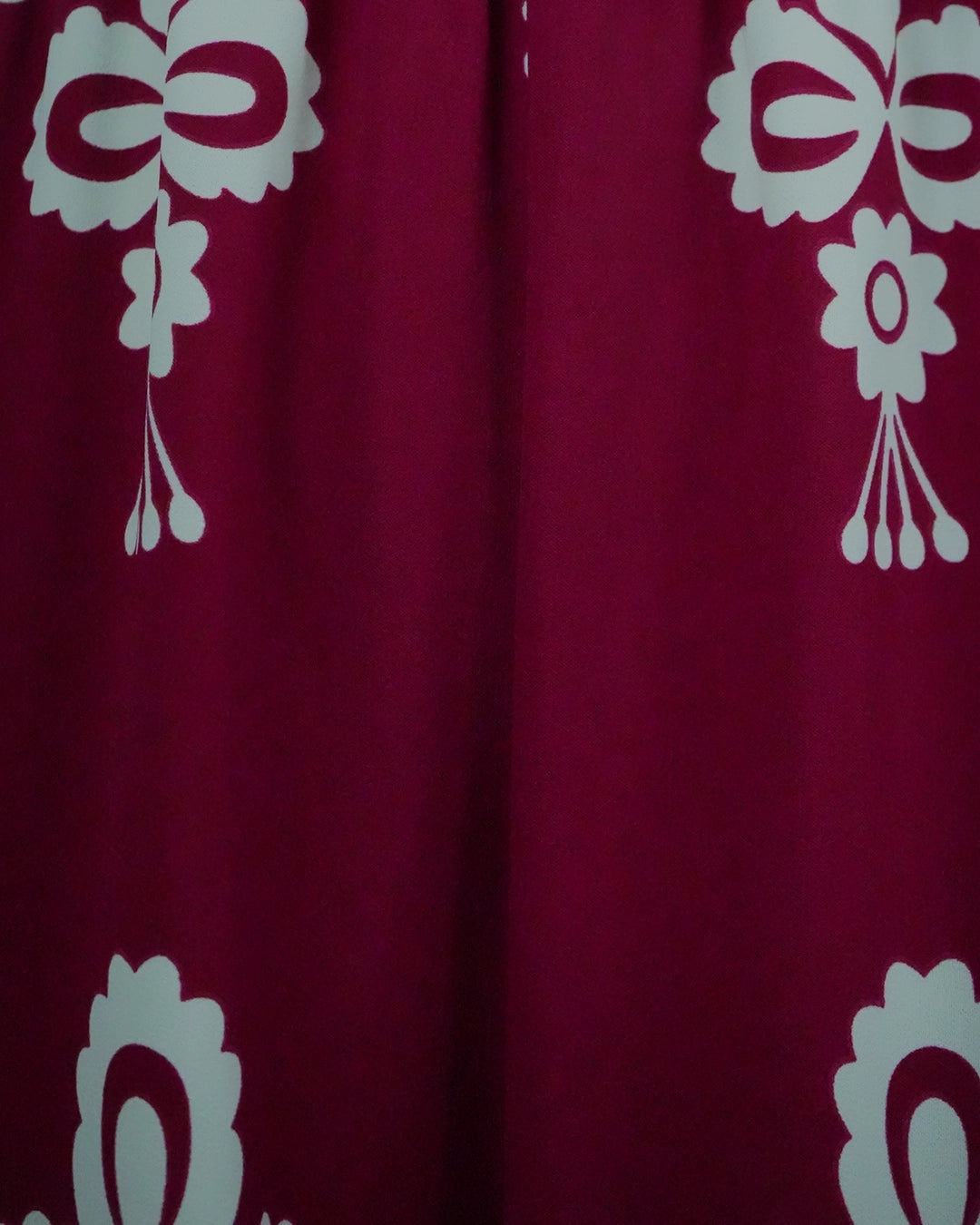 Red fabric with white floral patterns