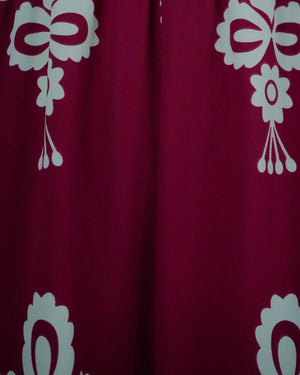 Red fabric with white floral patterns