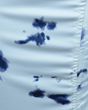 Close-up of a white fabric with blue ink stains