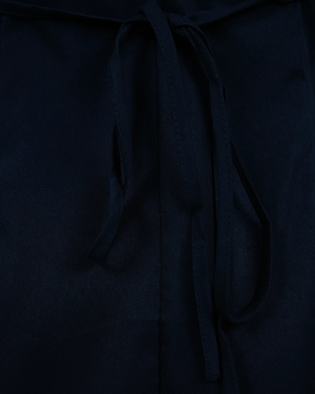 Dark blue fabric with a tie detail on a matching background