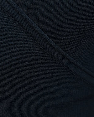 Close-up of dark blue fabric with a visible seam