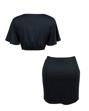 Black crop top and skirt set on a white background