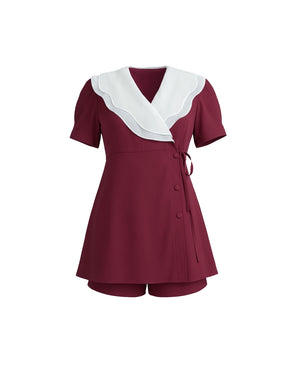 Maroon dress with white collar on a white background