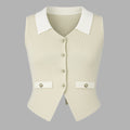 Beige vest with white collar and buttons on a gray background