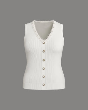 White ribbed knit vest with button details on a gray background