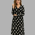 BeboNLolo black polka dot dress with relaxed fit and classic dot pattern – Front  View