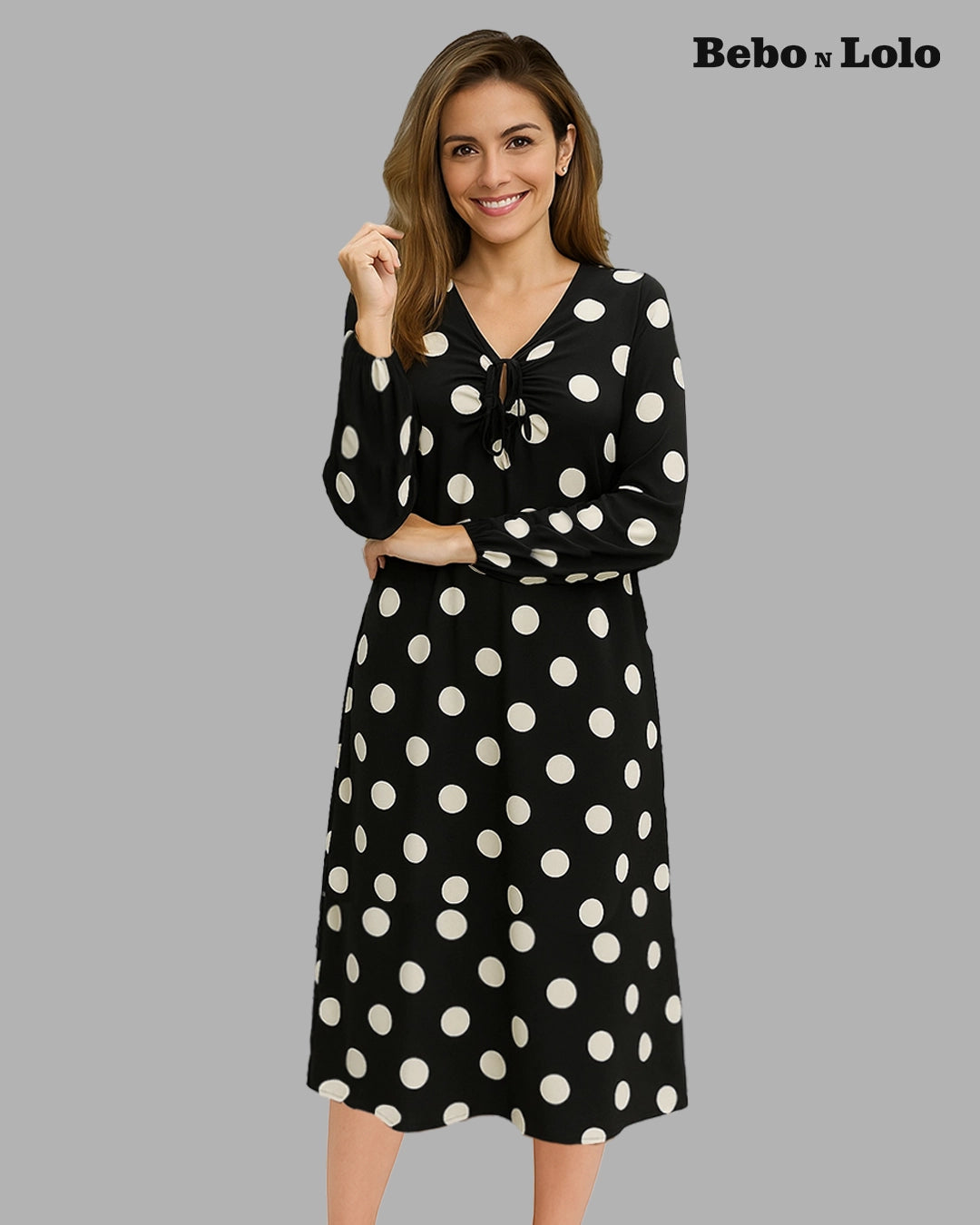 BeboNLolo black polka dot dress with relaxed fit and classic dot pattern – Front  View