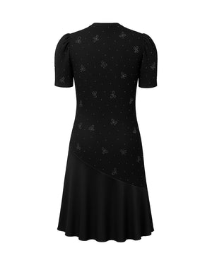Black dress with subtle pattern on a white background