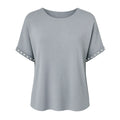 Gray t-shirt with decorative cut-out shoulders on a white background