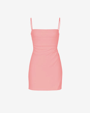 Pink dress with thin straps on a white background