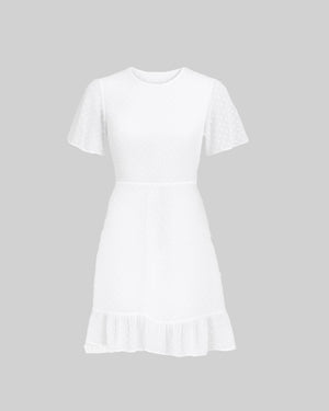 White dress with ruffled hem on a gray background