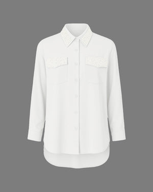 White shirt with lace details on a gray background