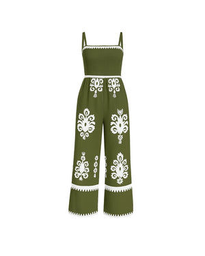 Green jumpsuit with white floral patterns on a white background