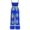Blue jumpsuit with white patterns on a white background