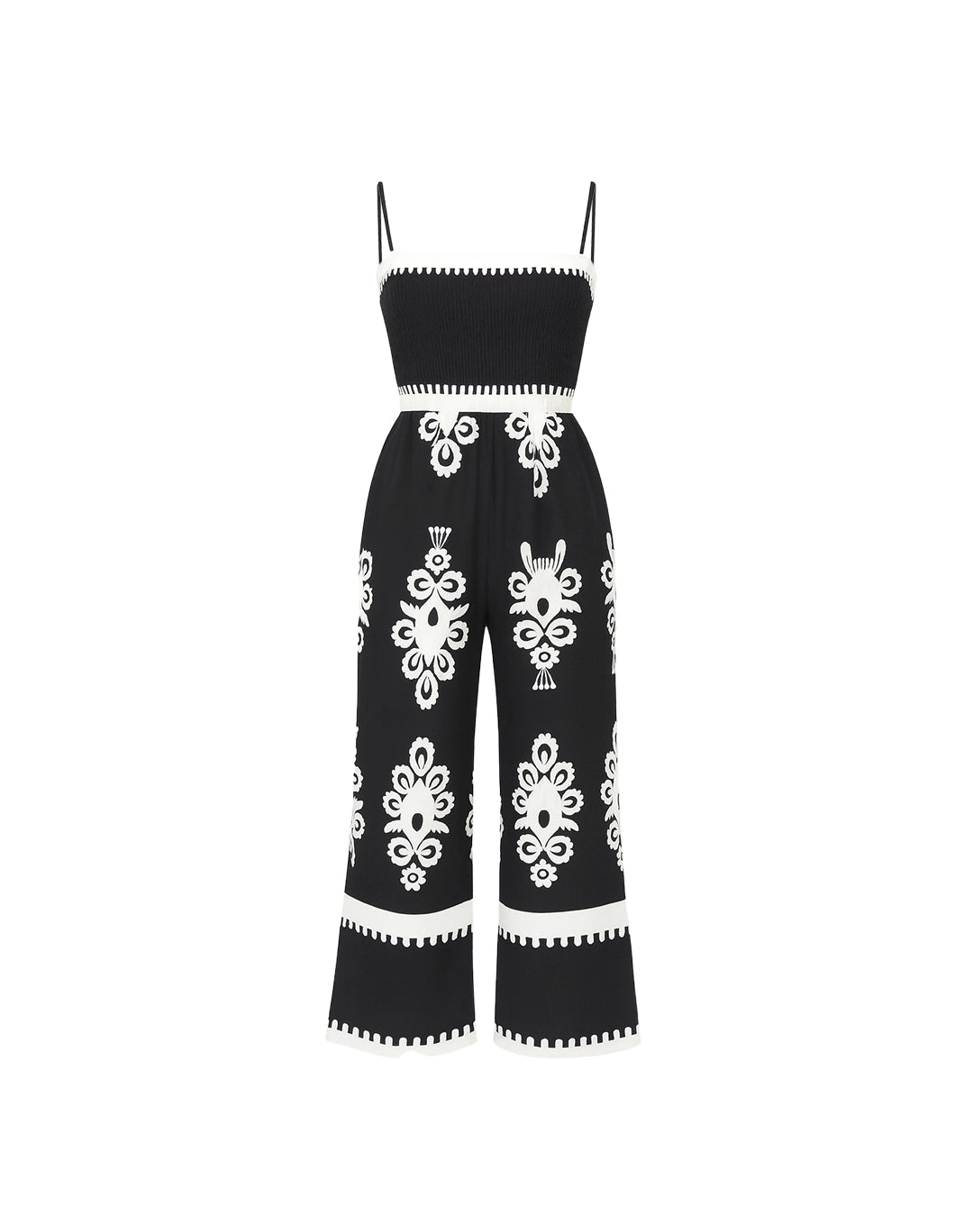 Black jumpsuit with white floral patterns on a white background