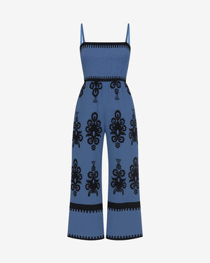 Blue jumpsuit with black pattern on a white background