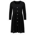 Black dress with buttons on a white background