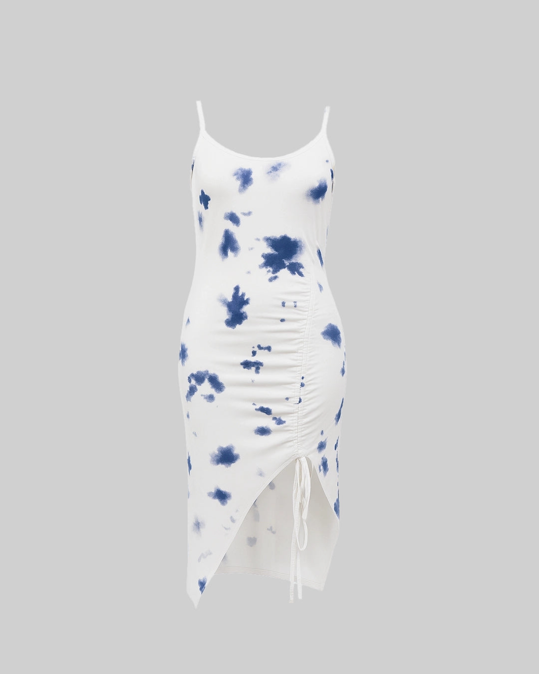 White dress with blue tie-dye pattern on a gray background