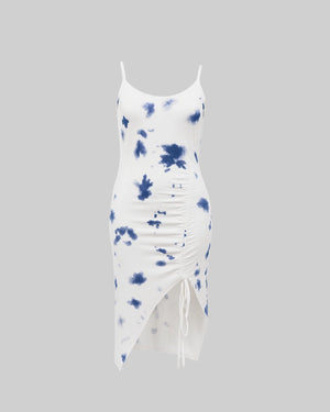 White dress with blue tie-dye pattern on a gray background