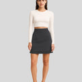 BeboNLolo black high-waist mini skirt with subtle embellishments and ruffle hem – Front View