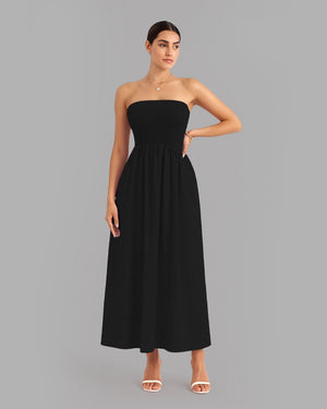 Woman wearing a black strapless dress on a gray background