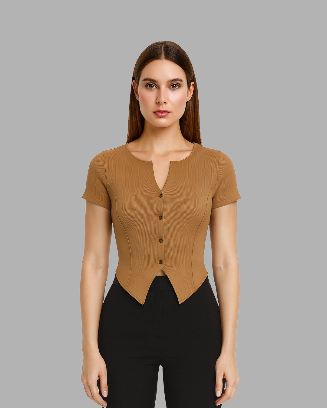 Woman wearing a brown short-sleeve top with buttons on a gray background