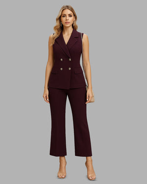 Woman wearing a burgundy suit on a gray background