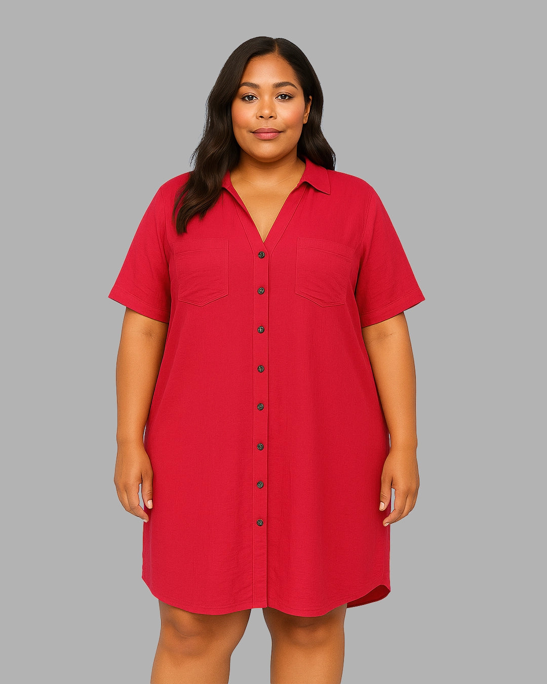 Woman wearing a red shirt dress against a gray background