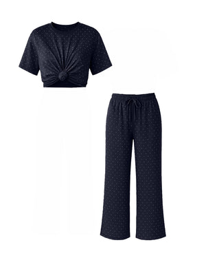 Navy blue pajama set with a top and pants on a white background