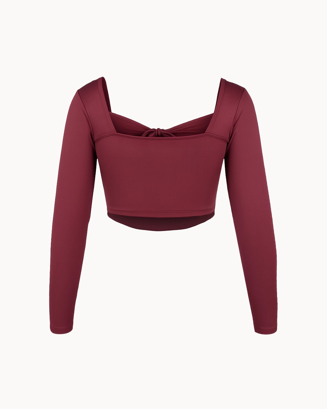 Maroon long-sleeve crop top on a white background