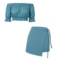 Teal off-shoulder top and skirt set on a white background