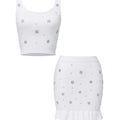 White crop top and skirt set with small floral patterns on a white background