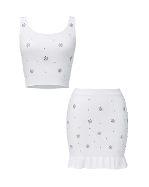 White crop top and skirt set with small floral patterns on a white background