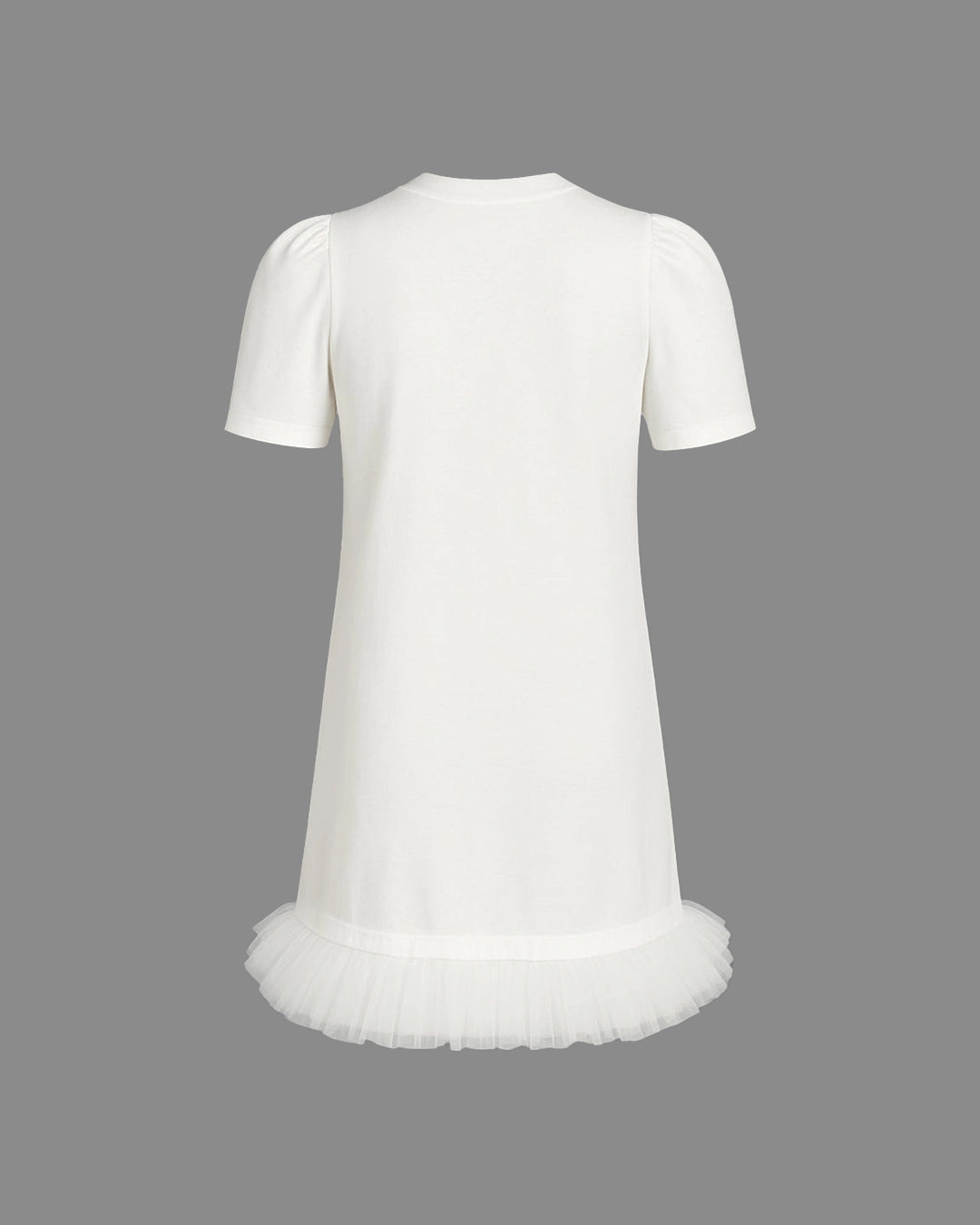 White dress with a tulle skirt on a gray background